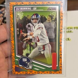 Panini Score Eli Manning Football Card - Orange and Blue